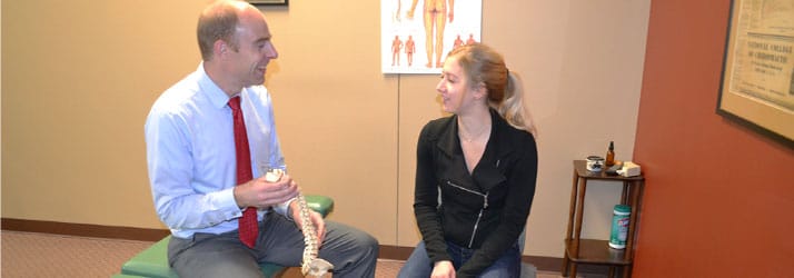 Chiropractor Neenah WI Matthew Clover with Patient